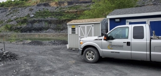 Process Masters truck next to shed